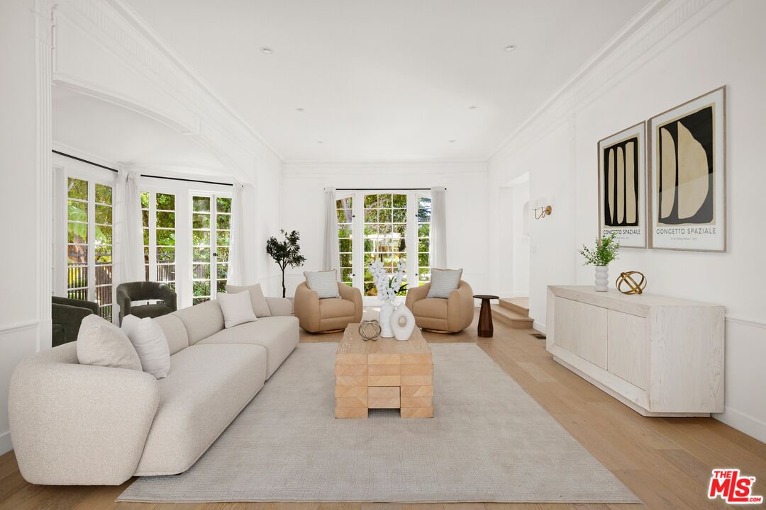 712 North Rodeo Drive Beverly Hills, CA 90210 - Photo 7 of 36 a living room with furniture and a large window