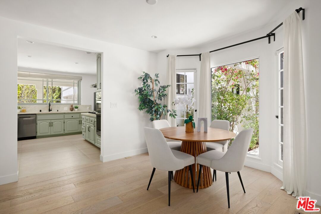 712 North Rodeo Drive Beverly Hills, CA 90210 - Photo 10 of 36 a view of a dining room with furniture window and wooden floor