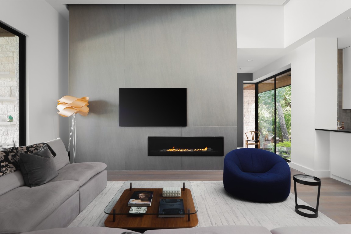 12900 Hacienda Ridge Austin, TX 78738 - Photo 11 of 40 a living room with furniture a flat screen tv and a window