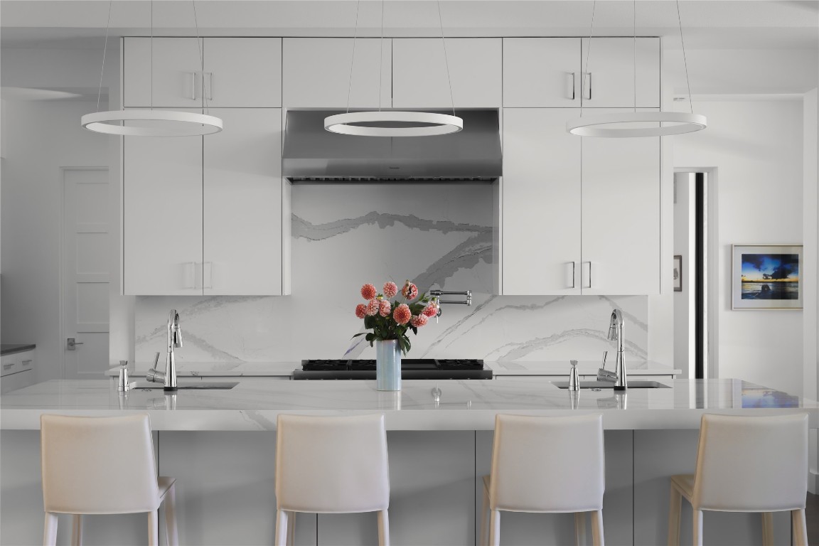 12900 Hacienda Ridge Austin, TX 78738 - Photo 13 of 40 a kitchen with cabinets a sink and white appliances