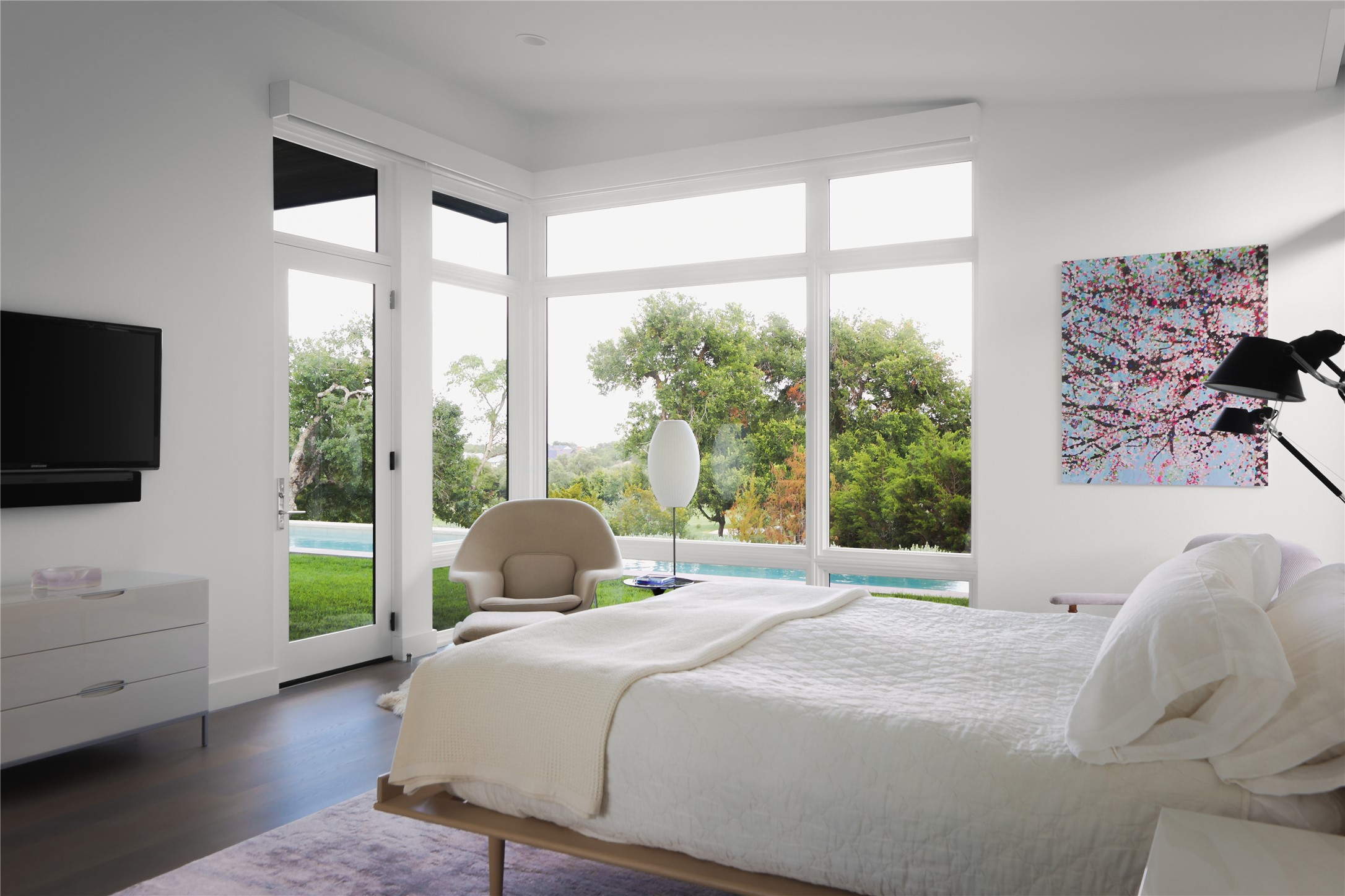 12900 Hacienda Ridge Austin, TX 78738 - Photo 18 of 40 a bedroom with a bed and a large window