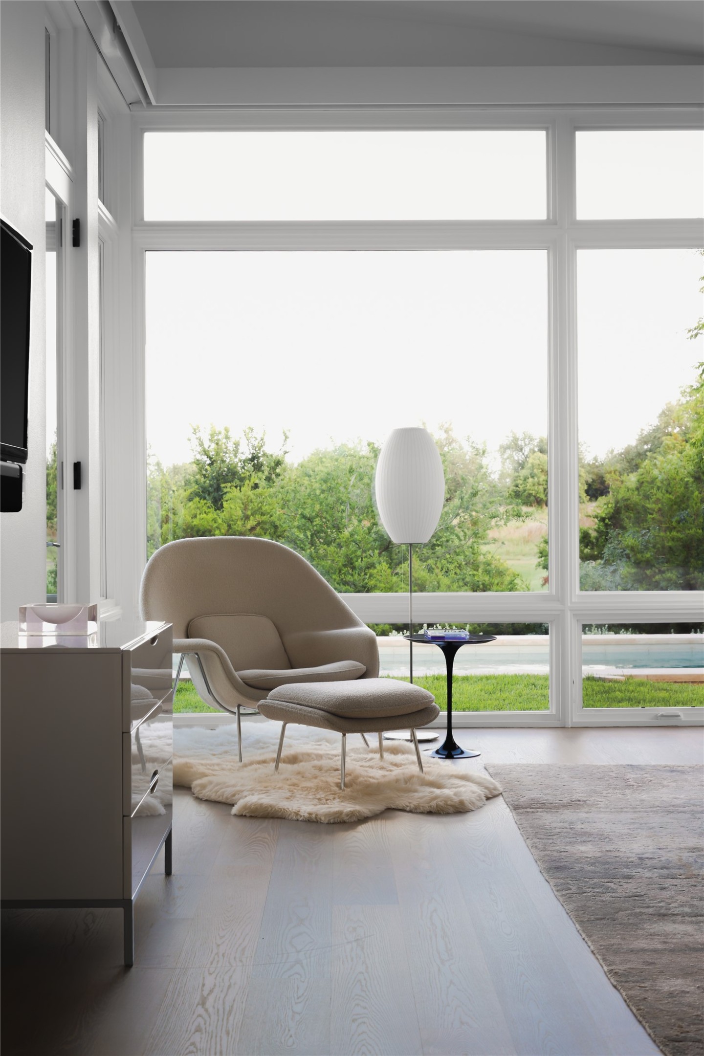 12900 Hacienda Ridge Austin, TX 78738 - Photo 19 of 40 a living room with a table and a large window