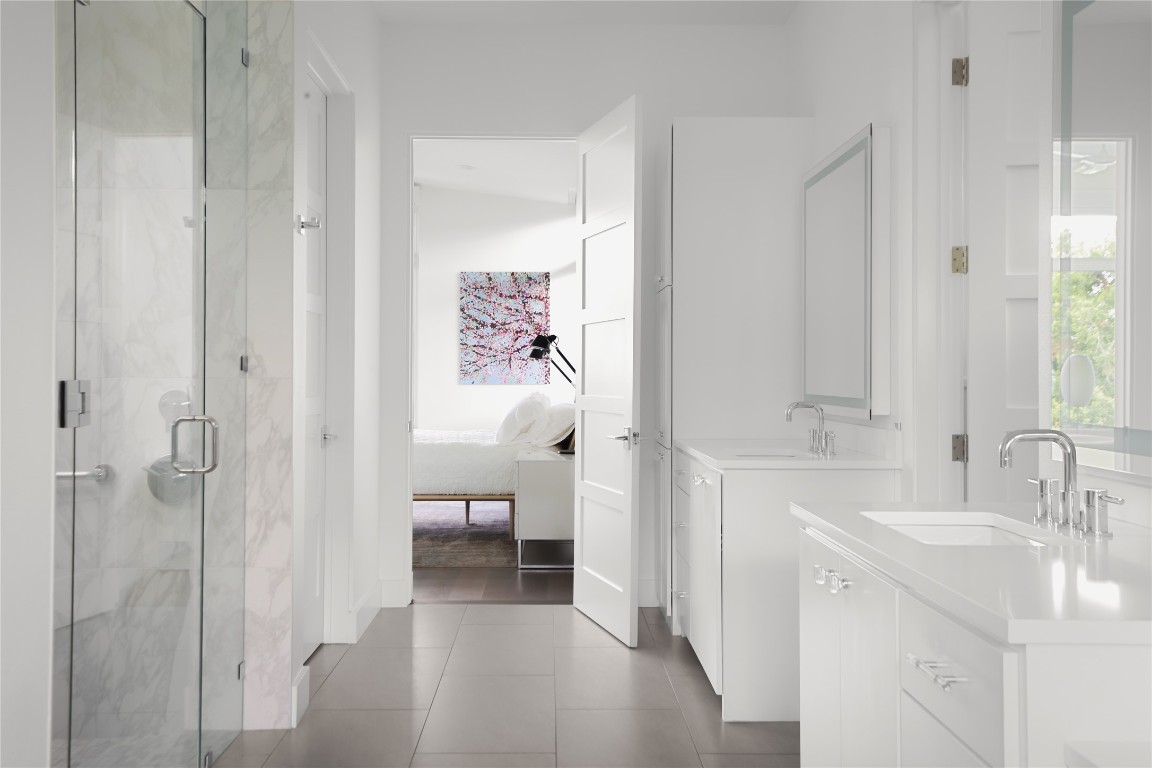 12900 Hacienda Ridge Austin, TX 78738 - Photo 20 of 40 a bathroom with a sink and a mirror