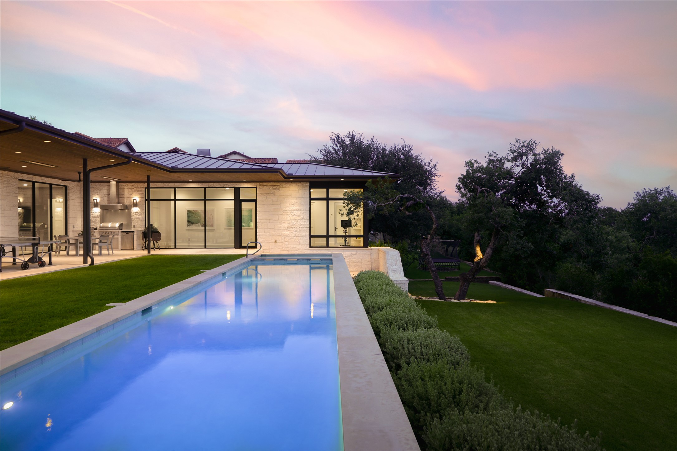 12900 Hacienda Ridge Austin, TX 78738 - Photo 2 of 40 a view of a house with a swimming pool and a yard