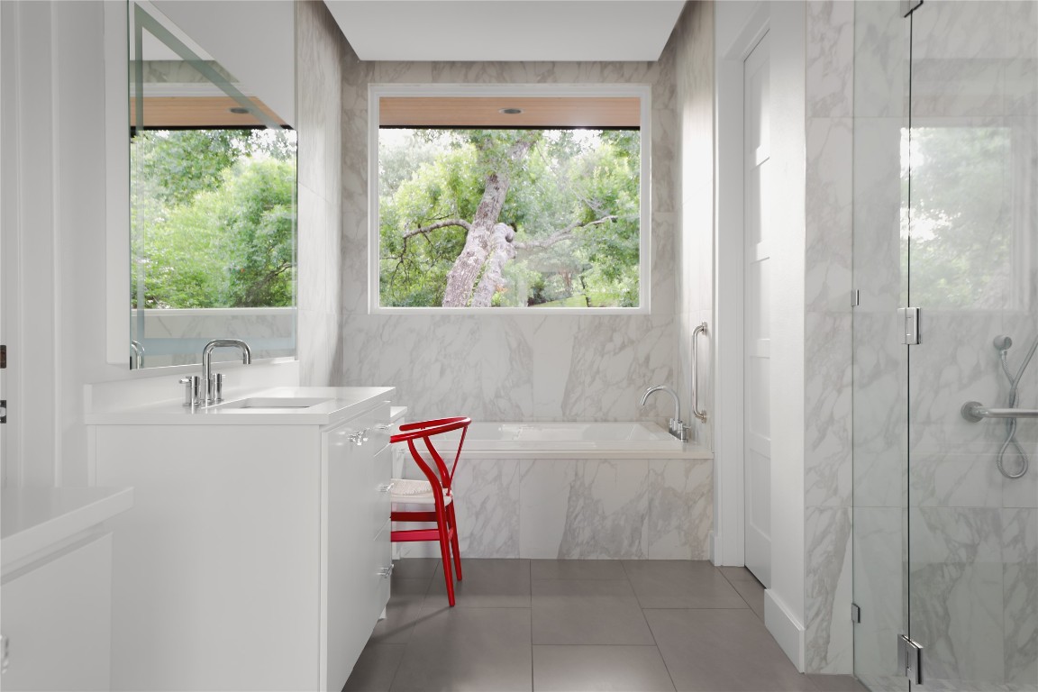 12900 Hacienda Ridge Austin, TX 78738 - Photo 21 of 40 a bathroom with a sink and a bathtub