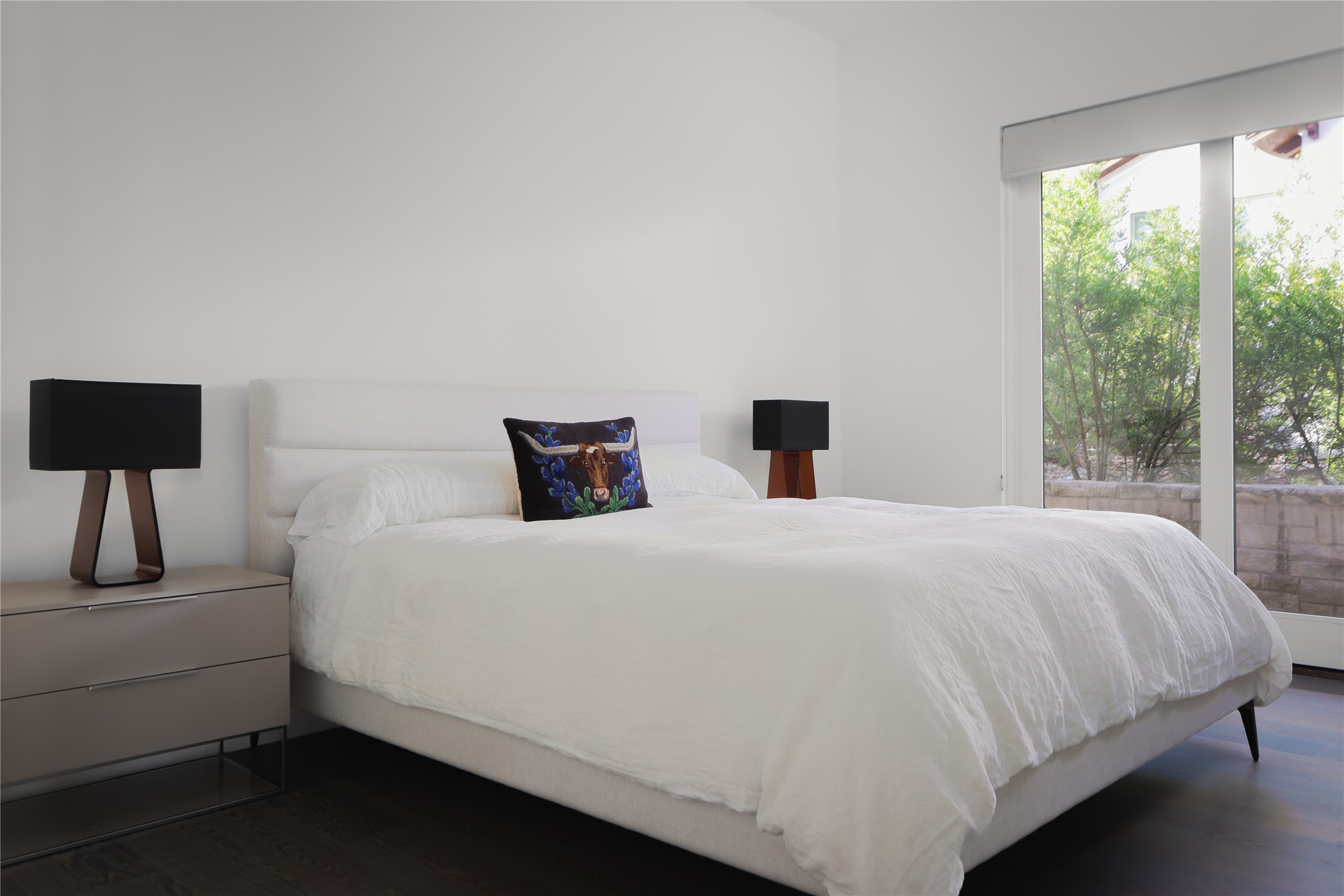 12900 Hacienda Ridge Austin, TX 78738 - Photo 25 of 40 a bedroom with a bed and a lamp