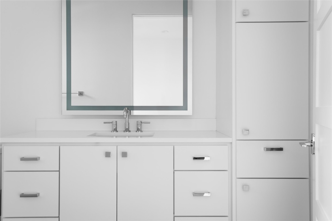 12900 Hacienda Ridge Austin, TX 78738 - Photo 30 of 40 a bathroom with a sink and a mirror