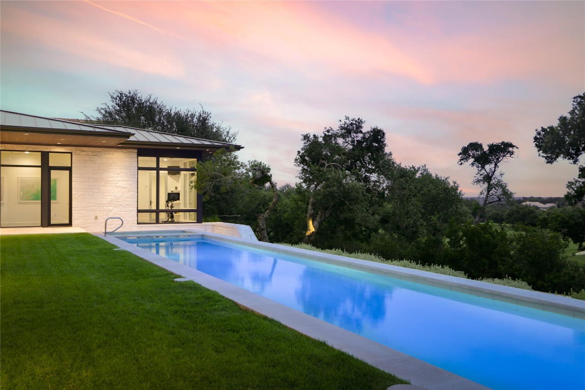 12900 Hacienda Ridge Austin, TX 78738 - Photo 32 of 40 a view of a house with backyard and porch