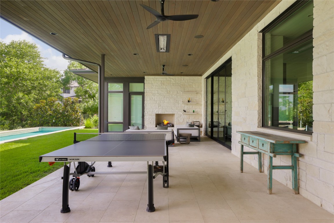 12900 Hacienda Ridge Austin, TX 78738 - Photo 38 of 40 a view of a patio with a table chairs and a swimming pool
