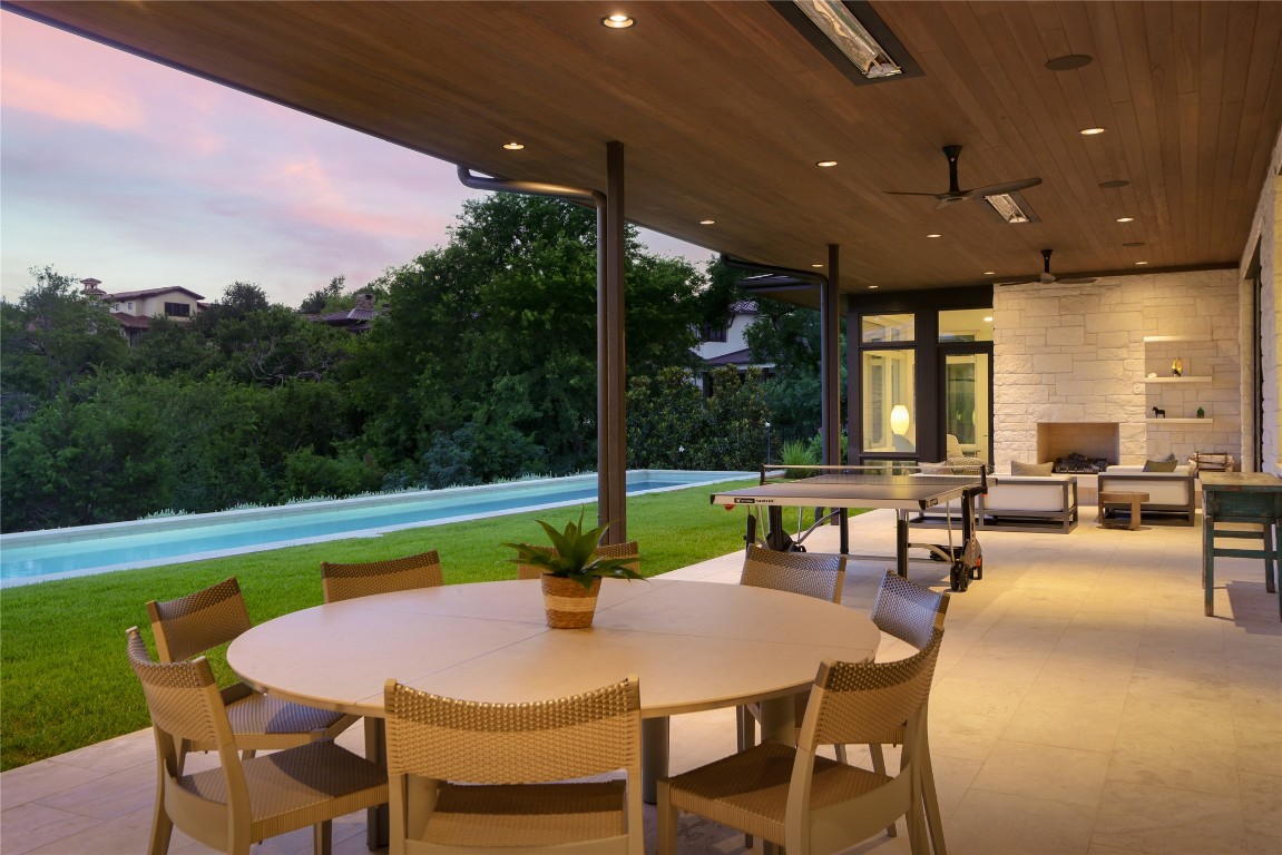 12900 Hacienda Ridge Austin, TX 78738 - Photo 39 of 40 a dining area with furniture and a garden