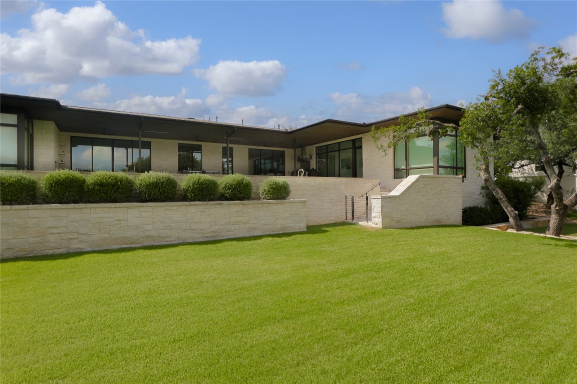 12900 Hacienda Ridge Austin, TX 78738 - Photo 40 of 40 a front view of house with yard and green space