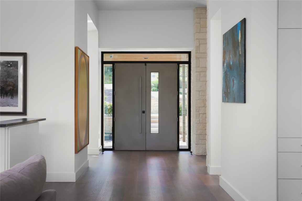 12900 Hacienda Ridge Austin, TX 78738 - Photo 6 of 40 a view of a livingroom with wooden floor and windows