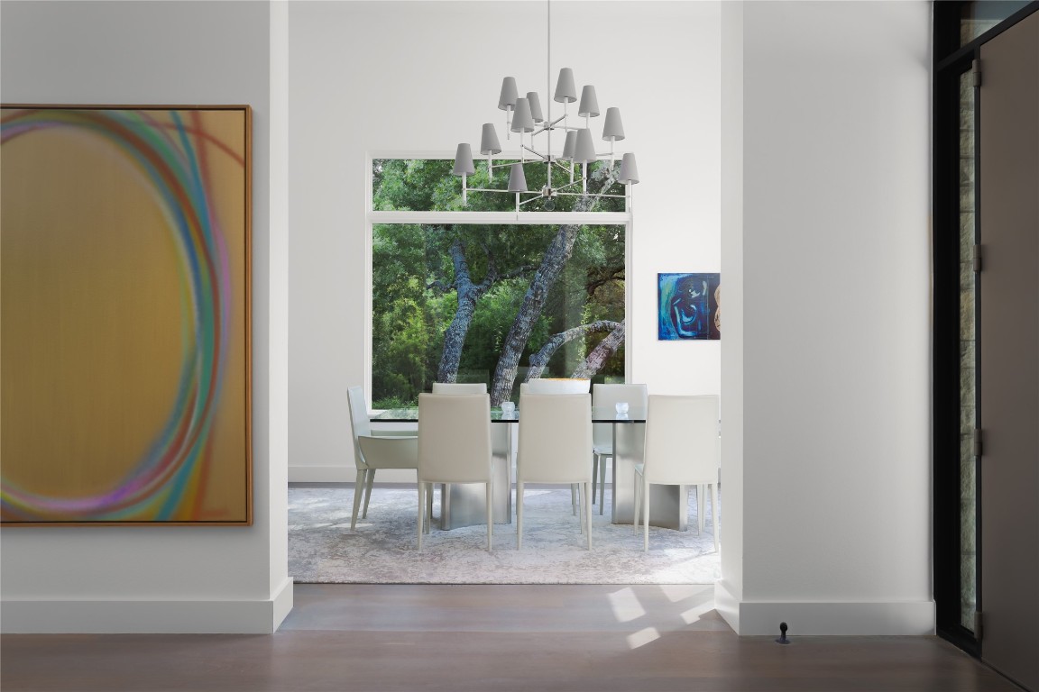 12900 Hacienda Ridge Austin, TX 78738 - Photo 7 of 40 a living room with furniture a window and a glass door