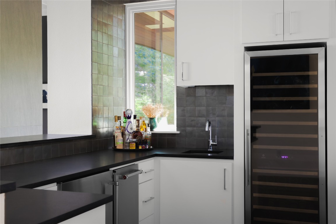12900 Hacienda Ridge Austin, TX 78738 - Photo 10 of 40 a kitchen with a sink and cabinets