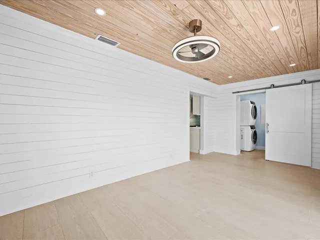 a kitchen with a stove a sink and a refrigerator