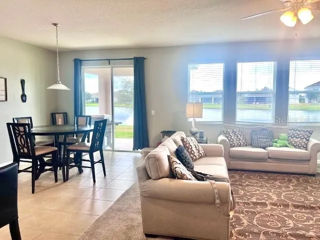 a view of a dining room with furniture window and outside view