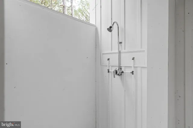 a bathroom with a glass door shower