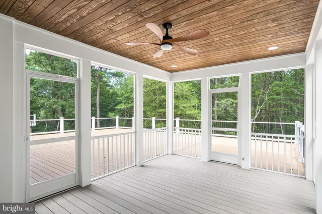 a view of a room with wooden floor and balcony