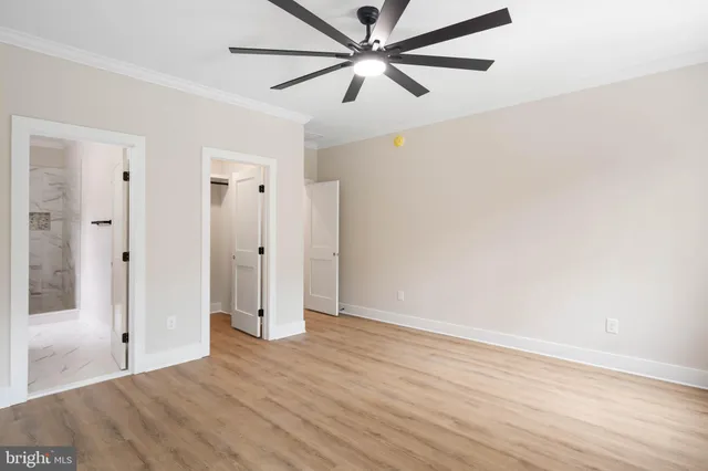 a bathroom with a granite countertop sink a toilet and a mirror