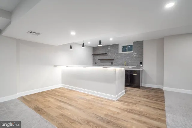 a view of a kitchen with a sink and a stove top oven