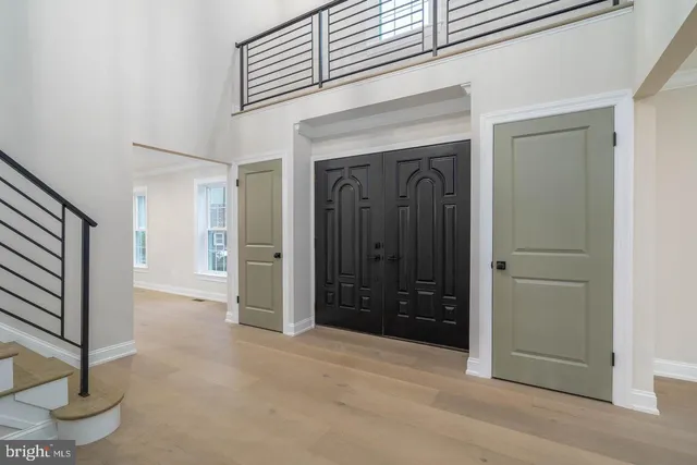 a view of a hallway with wooden shelves