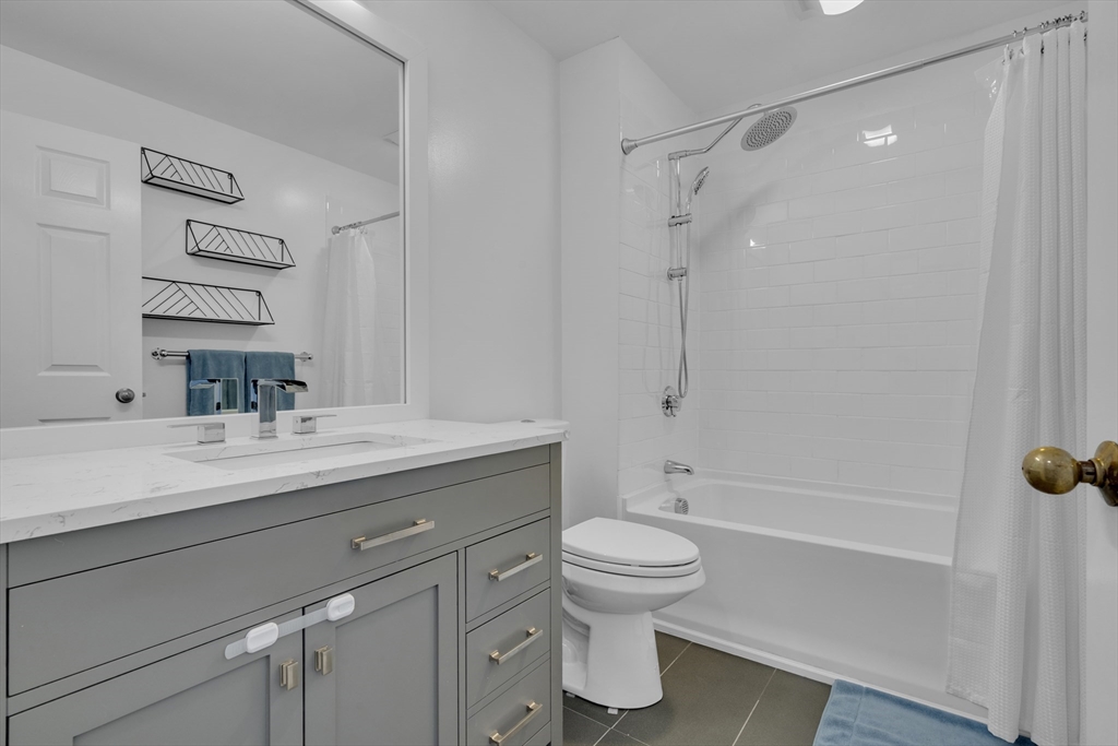 232 Summit Avenue, Unit A1 Brookline, MA 02446 - Photo 12 of 29 a bathroom with a sink toilet and shower