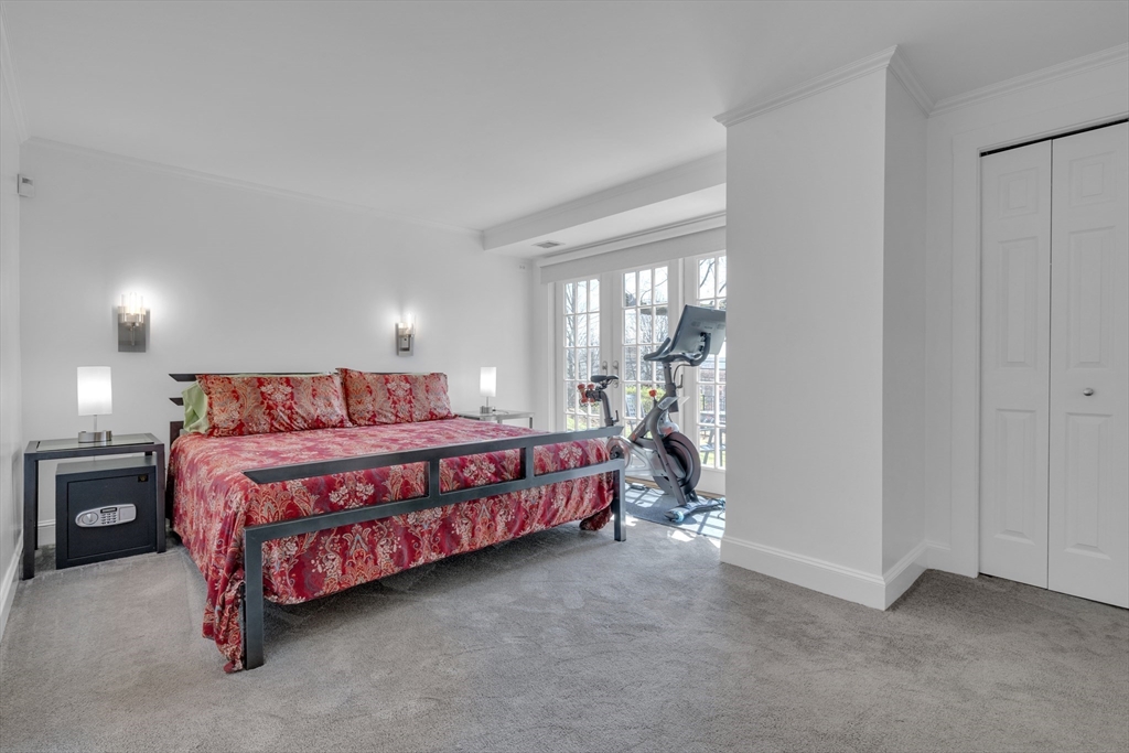 232 Summit Avenue, Unit A1 Brookline, MA 02446 - Photo 14 of 29 a bedroom with a bed and a night stand