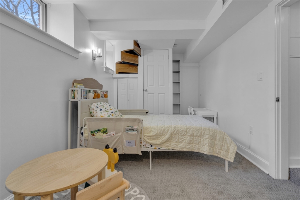 232 Summit Avenue, Unit A1 Brookline, MA 02446 - Photo 18 of 29 a bathroom with a sink toilet and mirror