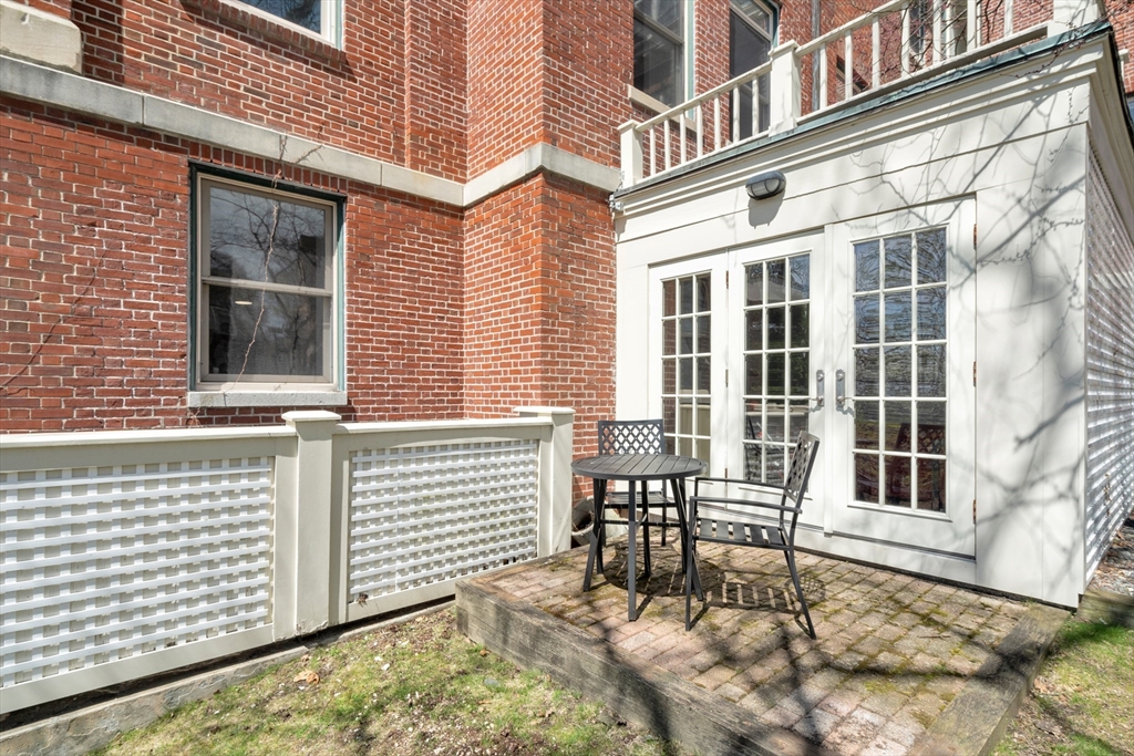 232 Summit Avenue, Unit A1 Brookline, MA 02446 - Photo 19 of 29 a view of a brick house with many windows