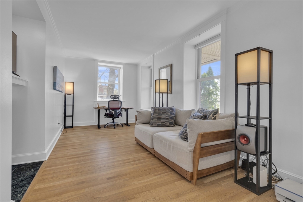 232 Summit Avenue, Unit A1 Brookline, MA 02446 - Photo 3 of 29 a living room with furniture and a table