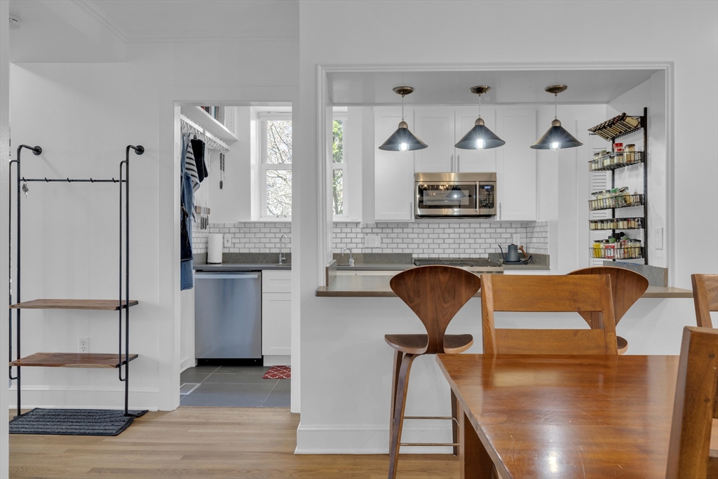 232 Summit Avenue, Unit A1 Brookline, MA 02446 - Photo 6 of 29 a living room with furniture and a fireplace