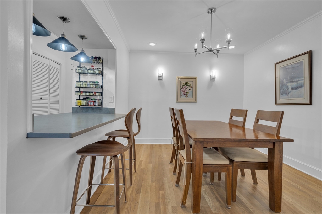 232 Summit Avenue, Unit A1 Brookline, MA 02446 - Photo 10 of 29 a view of a dining room with furniture and wooden floor