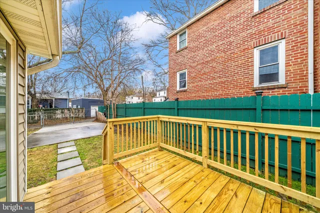 a view of a brick house with a yard
