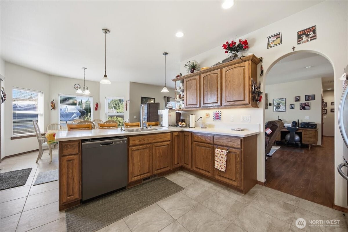 2304 Road 52 Pasco, WA 99301 - Photo 15 of 39 a kitchen with stainless steel appliances granite countertop a sink and cabinets
