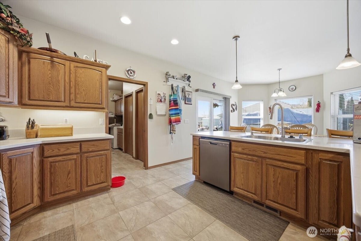 2304 Road 52 Pasco, WA 99301 - Photo 16 of 39 a kitchen with granite countertop a sink appliances and cabinets