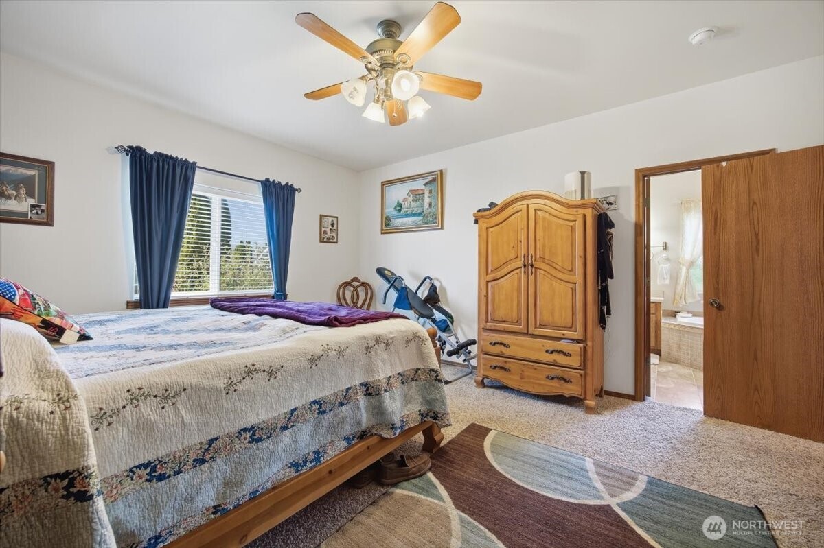 2304 Road 52 Pasco, WA 99301 - Photo 18 of 39 a bedroom with a bed dresser and a window