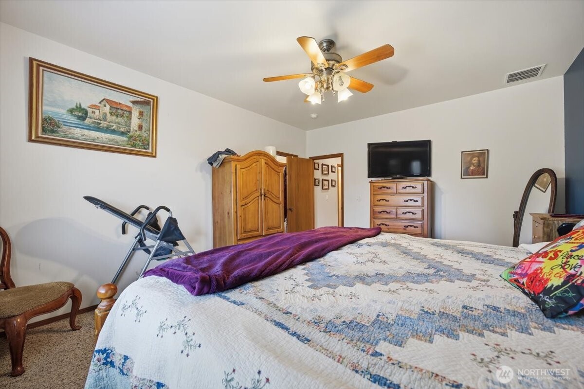 2304 Road 52 Pasco, WA 99301 - Photo 19 of 39 a bedroom with bed and wooden floor