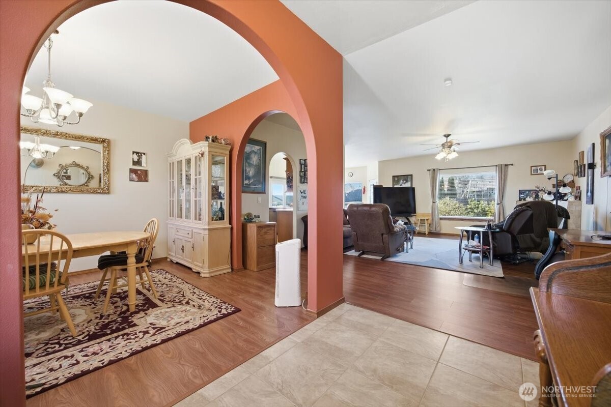 2304 Road 52 Pasco, WA 99301 - Photo 5 of 39 a living room with furniture a rug and wooden floor