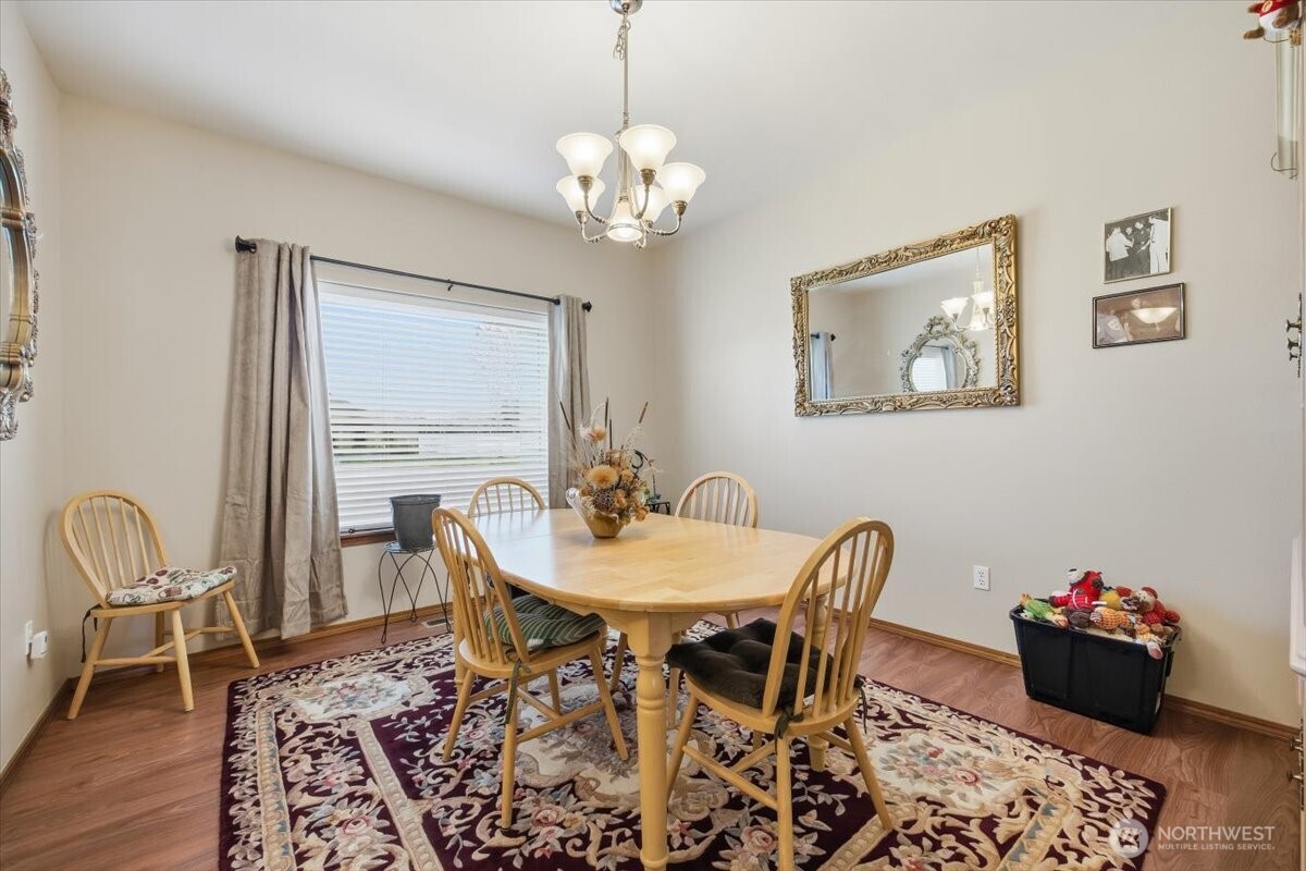 2304 Road 52 Pasco, WA 99301 - Photo 6 of 39 a view of a dining room with furniture and wooden floor