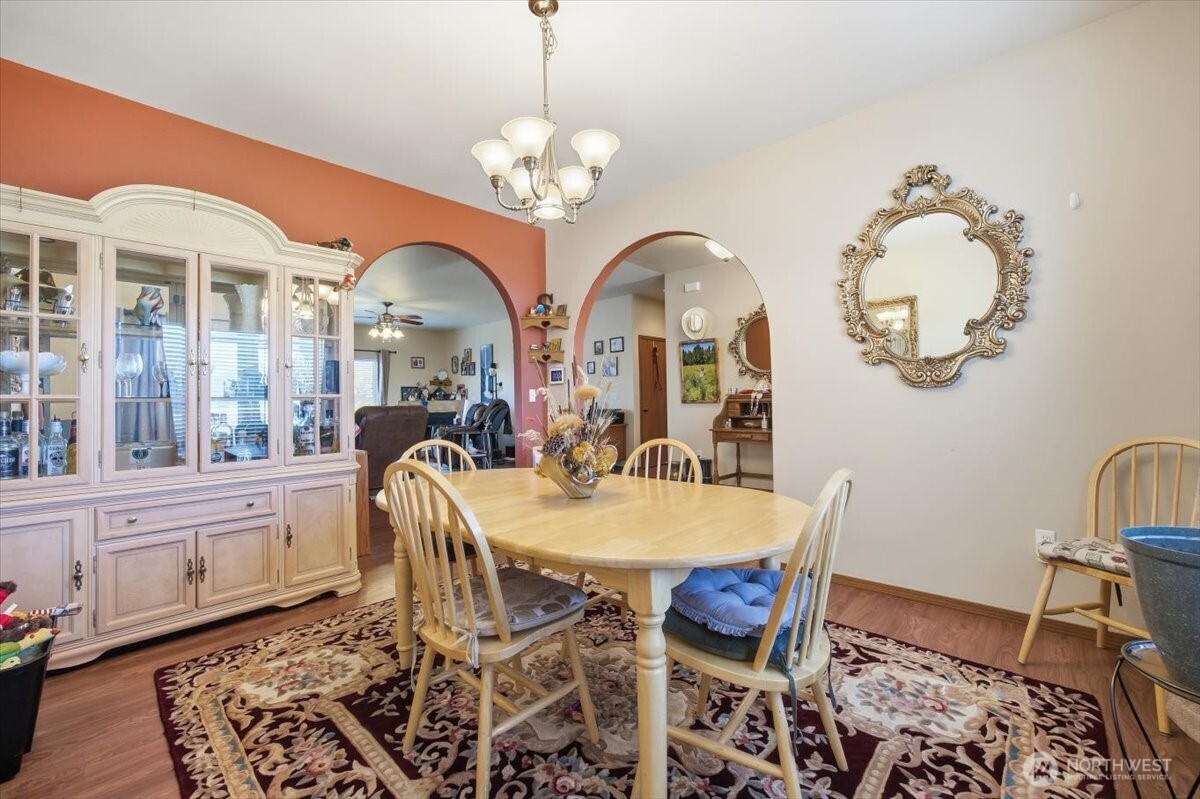2304 Road 52 Pasco, WA 99301 - Photo 7 of 39 a view of a dining room with furniture and chandelier