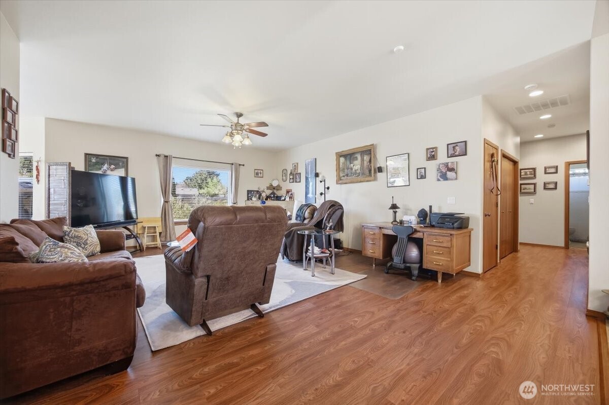 2304 Road 52 Pasco, WA 99301 - Photo 9 of 39 a living room with furniture and a wooden floor