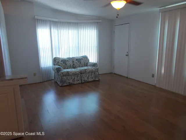 a bathroom with mirror and tiles