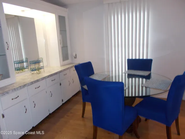 a view of a chair and wooden floor