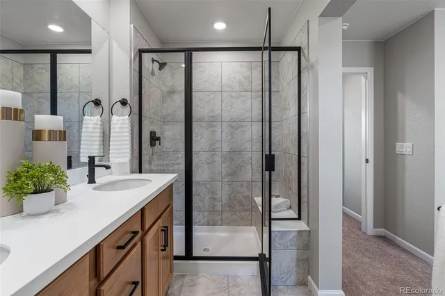 a bath tub sitting next to a white toilet and shower