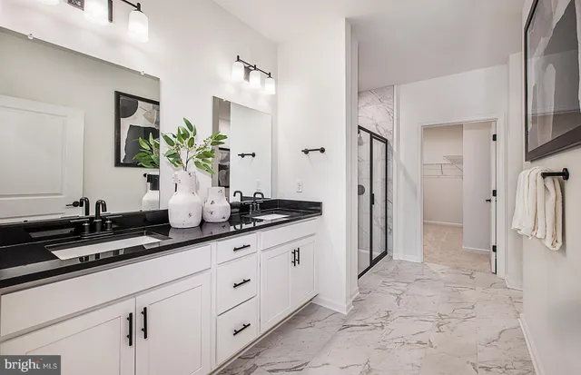 a kitchen with stainless steel appliances a sink stove and refrigerator