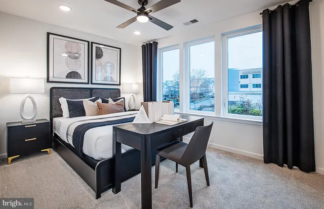 a bedroom with a large bed and a window