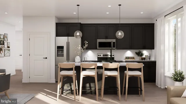 a large kitchen with a table and chairs
