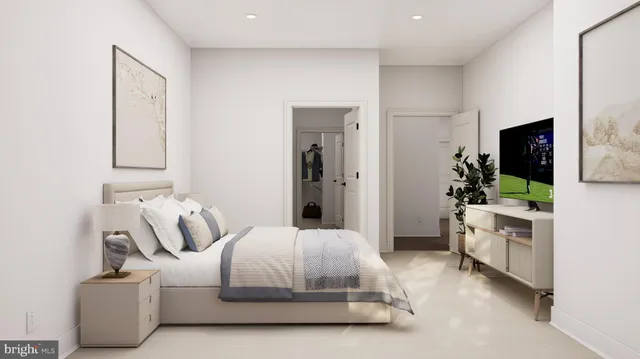 a bedroom with furniture and a flat screen tv