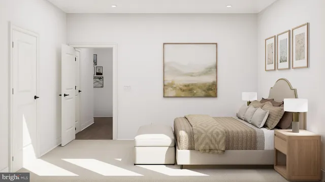 a bedroom with a bed and a painting on the wall