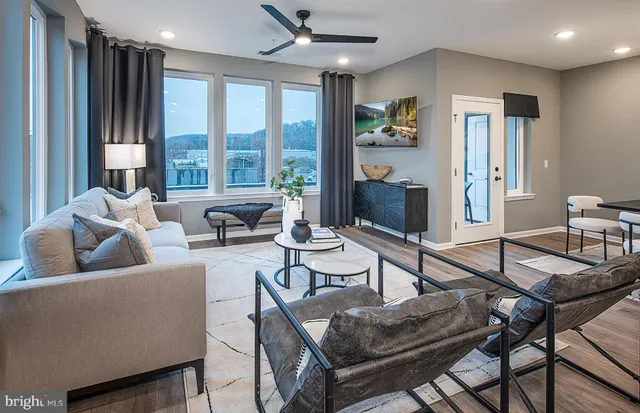 a living room with furniture and a large window